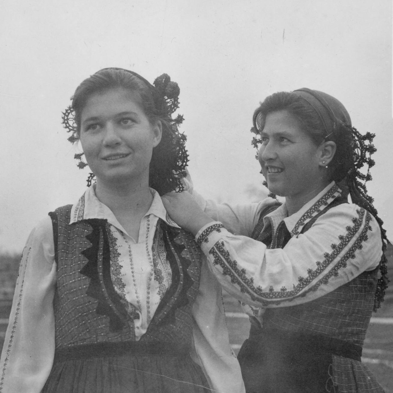 Brides in traditional costumes - black and white photo.