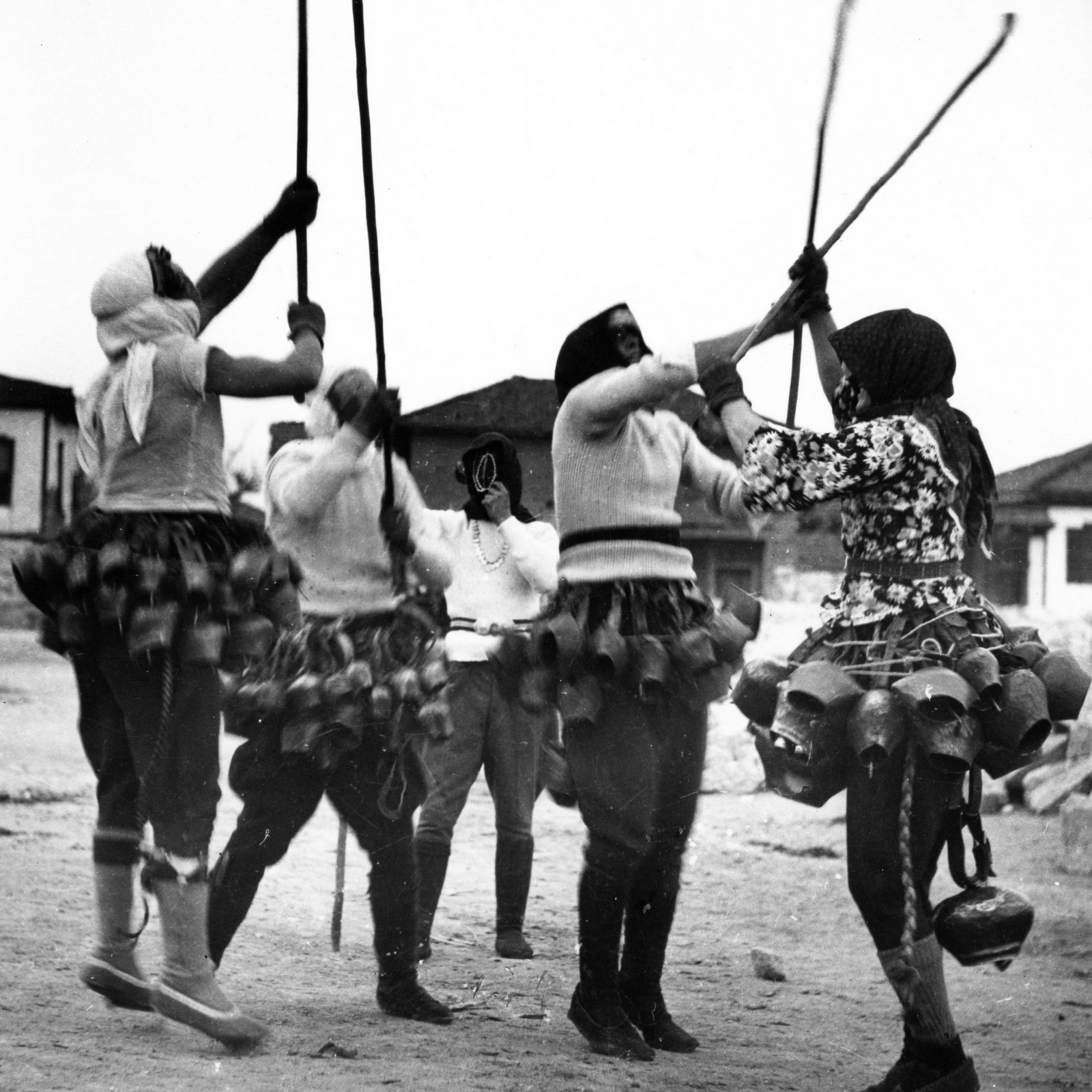 Mummers perform a folk custom - black and white photo.