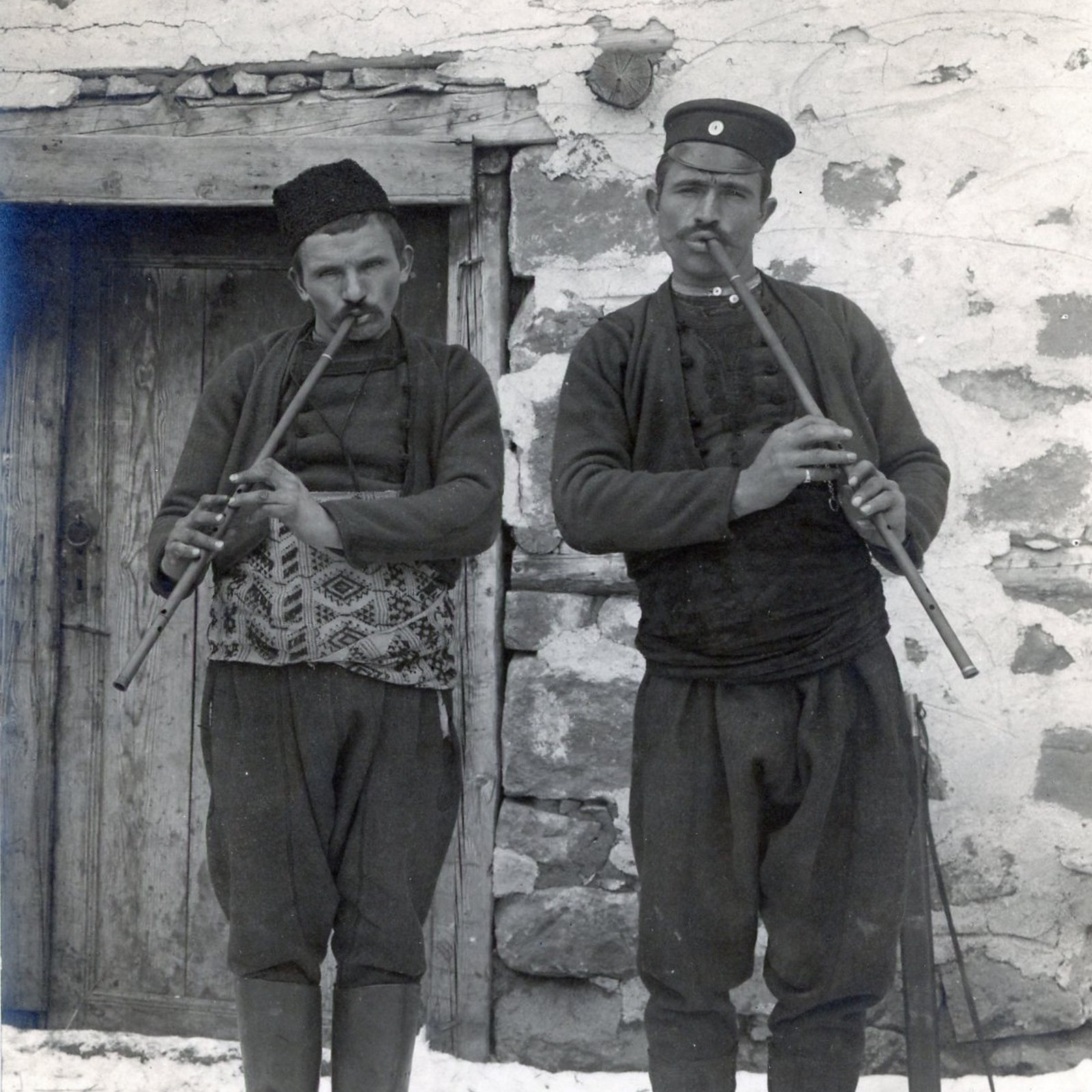 Musicians playing the flute - black and white photo.